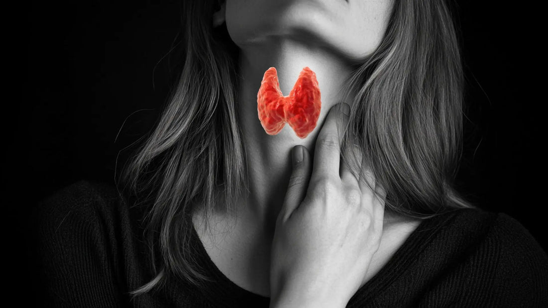 Young woman is touching her neck near to thyroid.